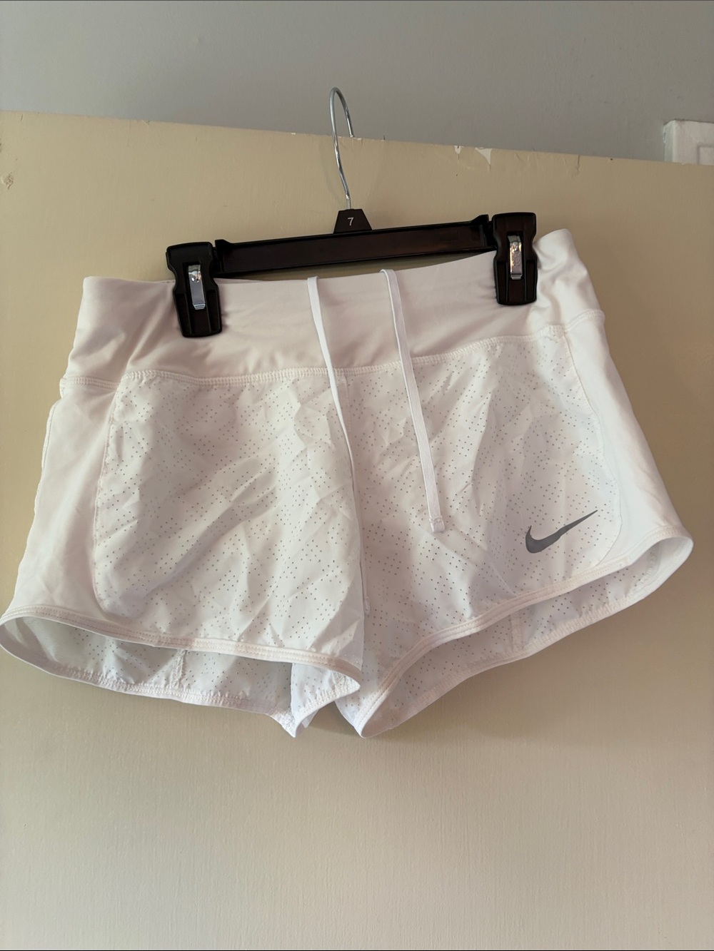 Nike White Perforated Women's Athletic Shorts with Silver Swoosh